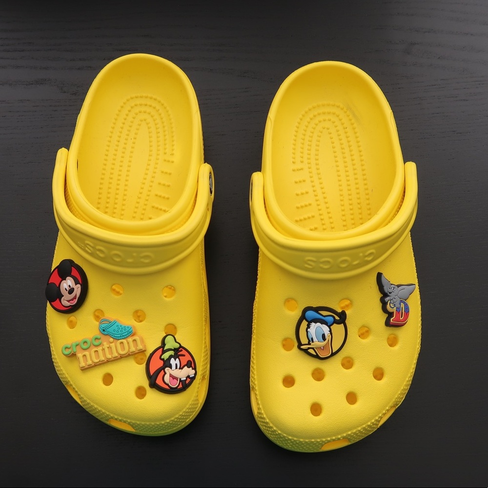 Yellow CROCS with Charms. Size 7 Women/ 5 Men